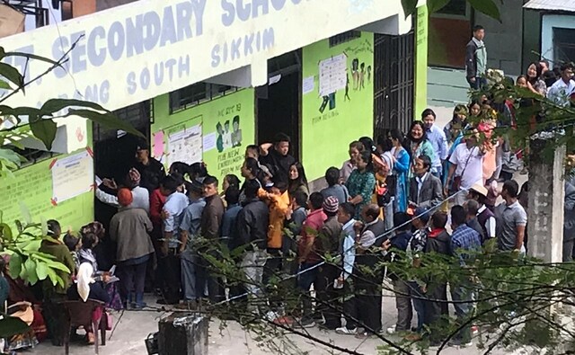 Voters queue up outside a polling booth in Poklok Kamrang in Sikkim. Bye-election is being held in the Poklok Kamrang Assembly in south Sikkim. Roshan Gupta/101Reporters Voters queue up outside a polling booth in Poklok Kamrang in Sikkim. Bye-election is being held in the Poklok Kamrang Assembly in south Sikkim. Roshan Gupta/101Reporters