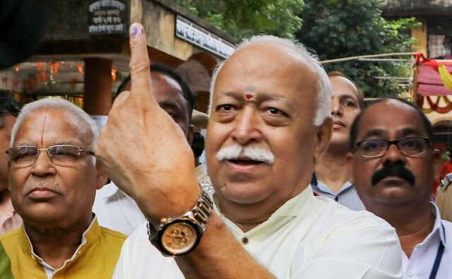 RSS chief Mohan Bhagwat poses for photographers after casting his vote in Nagpur district of Maharashtra. PTI RSS chief Mohan Bhagwat poses for photographers after casting his vote in Nagpur district of Maharashtra. PTI