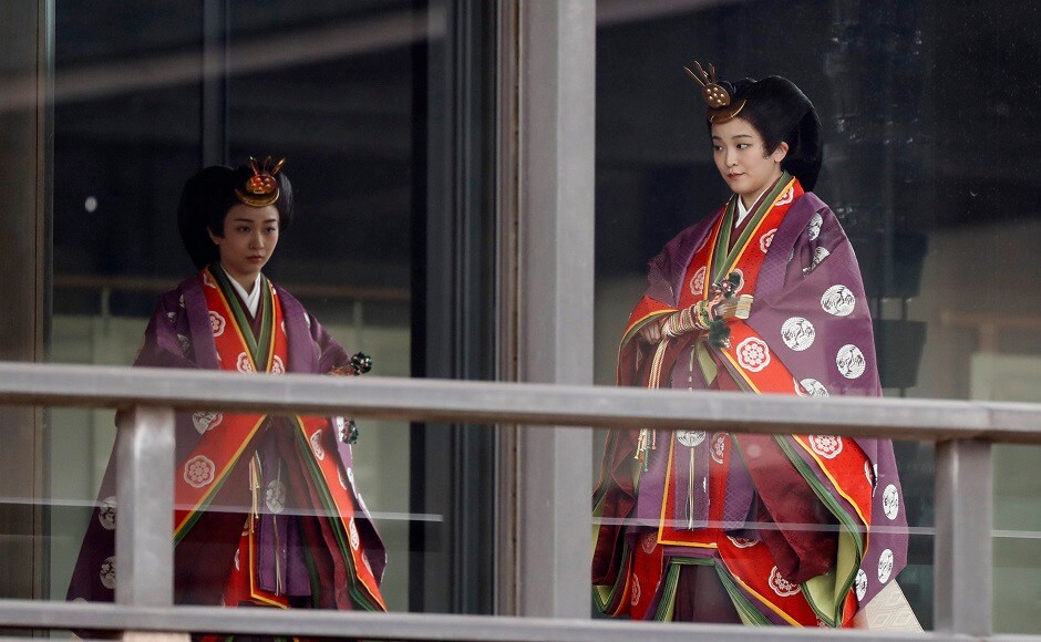 Naruhito and Masako, a Harvard-educated former diplomat, were to host a court banquet later on Tuesday which was to be attended by about 400 foreign dignitaries and representatives from Japan's administrative, legislative and judicial branches and their spouses. In this image, Masako can be seen walking with Princess Kako, during the ascension, called <em>Sokuirei-Seiden-no-gi</em>. AP Naruhito and Masako, a Harvard-educated former diplomat, were to host a court banquet later on Tuesday which was to be attended by about 400 foreign dignitaries and representatives from Japan's administrative, legislative and judicial branches and their spouses. In this image, Masako can be seen walking with Princess Kako, during the ascension, called <em>Sokuirei-Seiden-no-gi</em>. AP