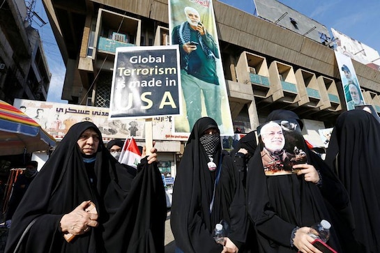 Chanting anti-U.S. slogans, Iraq militia supporters mark year since Soleimani's killing