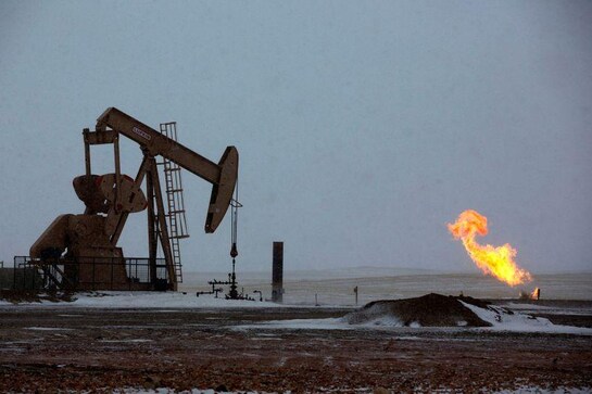 Big oil faces 'survival mode' payout strategies as prices dive Big oil faces 'survival mode' payout strategies as prices dive