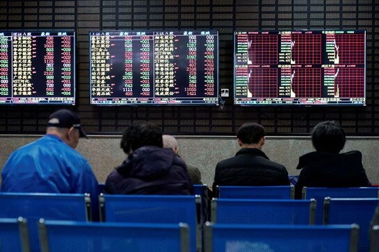 Asian shares nudge higher in defensive trade, dollar soft