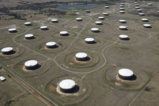 Oil settles up after hitting 15-month highs on demand prospects