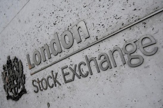 Stocks hover near record highs as bond yields slide