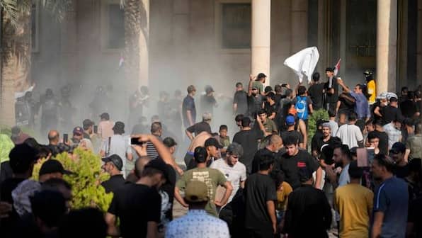 Clashes erupt after influential Iraqi Shiite cleric resigns; at least 15 protesters killed