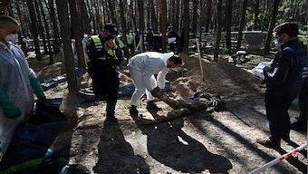 'Hands tied, jaws broken:' What we know about the mass burial site in Ukraine's Izyum
