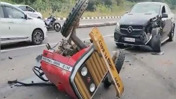 Tractor breaks into two parts after collision with Mercedes Benz