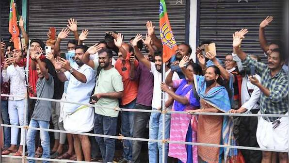 In pics: People brave rains to greet Prime Minister Narendra Modi in Kerala