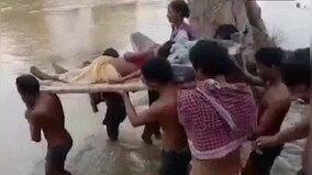 Chattisgarh: Woman taken to hospital on cot as heavy rain cuts off village