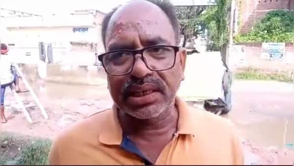 Watch: E-rickshaw topples over as commuter explains about poor road condition to reporter