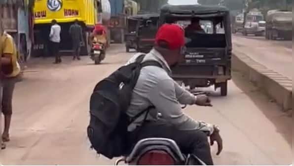 Viral: Man rides bike with both legs on one side, fined Rs 4,200