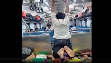 Watch: Man swings like Spiderman inside train, internet left amazed