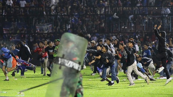 At least 125 dead after stampede, riot at Indonesia football match