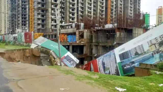 Noida: Part of main road, construction site caves in due to heavy downpour in Noida; no casualty Noida: Part of main road, construction site caves in due to heavy downpour in Noida; no casualty