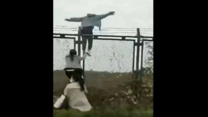 Watch: Workers flee COVID-19 lockdown at China's biggest iPhone factory