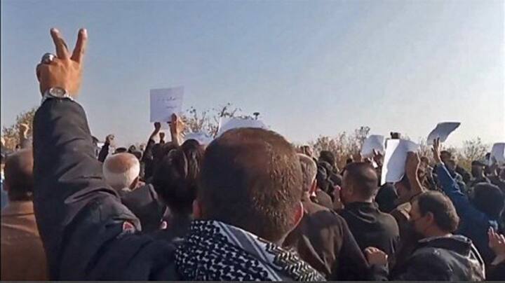 Iran security forces 'open fire' as thousands mourn Mahsa Amini in her hometown