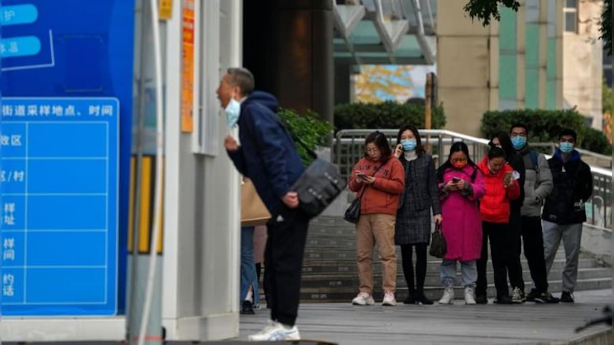 As workers flee biggest iPhone factory in China, authorities clamp COVID lockdown in whole area around Foxconn