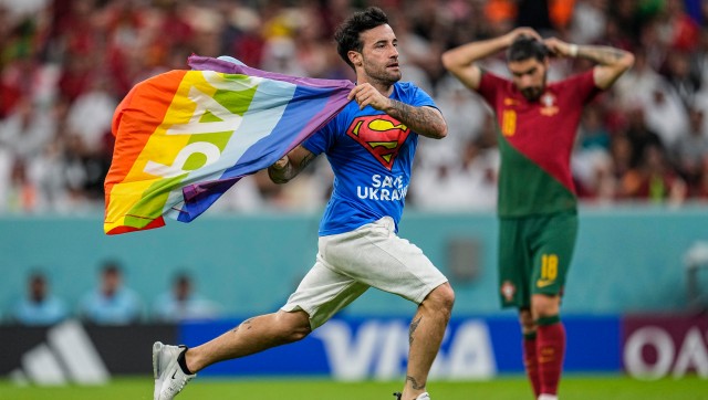 FIFA World Cup: Man with rainbow flag invades pitch during Portugal vs Uruguay FIFA World Cup: Man with rainbow flag invades pitch during Portugal vs Uruguay
