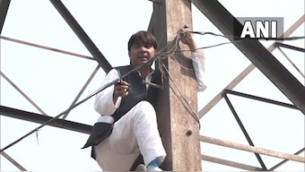 WATCH: Former AAP councillor climbs tower after party denied him Delhi civic polls ticket
