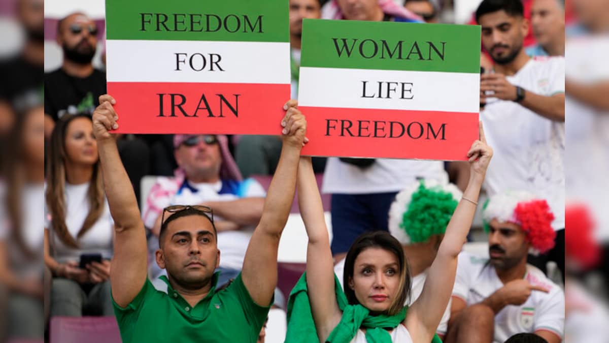 Barred from stadiums at home, Iranian women attend Football World Cup in Qatar