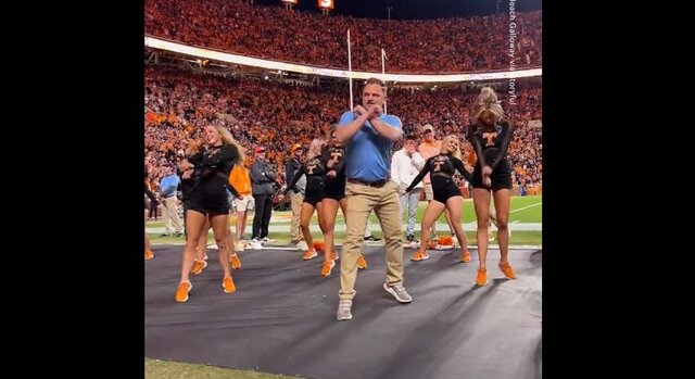 Viral video: Man dressed as 'security guard' joins cheerleading squad to show off his dancing moves Viral video: Man dressed as 'security guard' joins cheerleading squad to show off his dancing moves