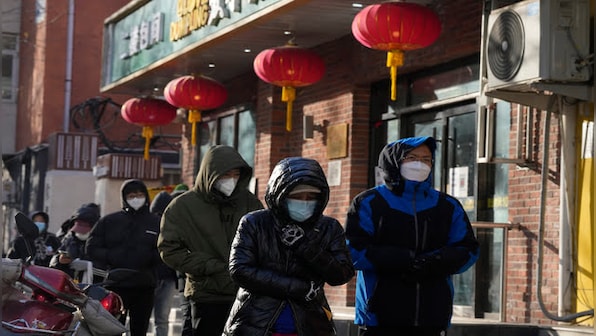 ‘Panic buying’ and shortages hit China as Covid-19 curbs are eased