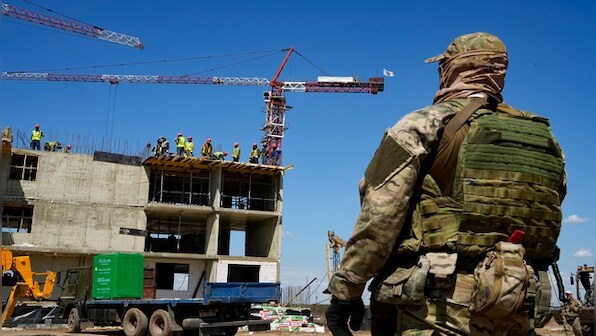 Russia erases Mariupol's Ukraine identity by tearing out bombed out buildings, builds on death