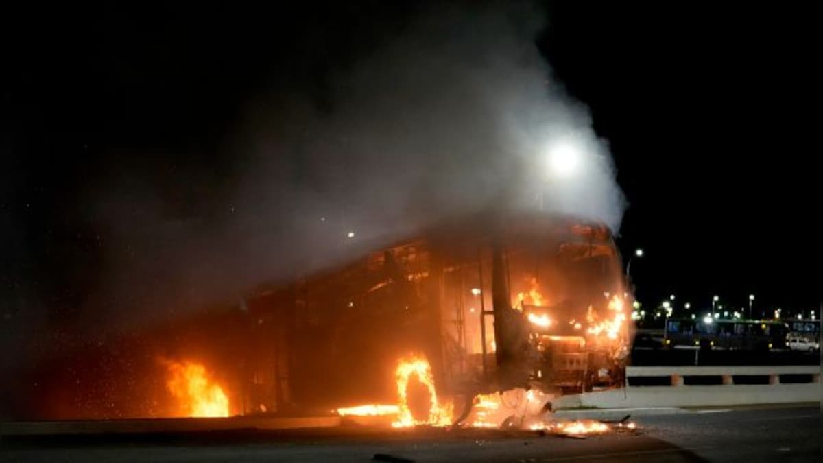 Brazil: Supporters of Jair Bolsonaro clash with police in Brasilia – Firstpost