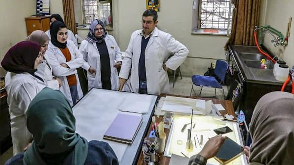 Iraqi conservators strive to preserve ancient manuscripts