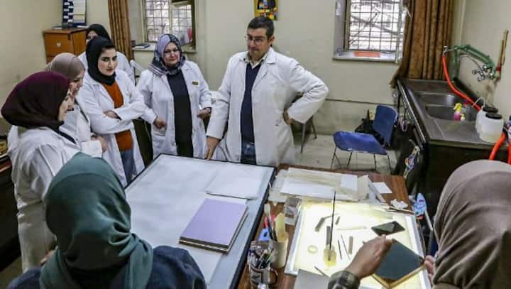 Iraqi conservators strive to preserve ancient manuscripts
