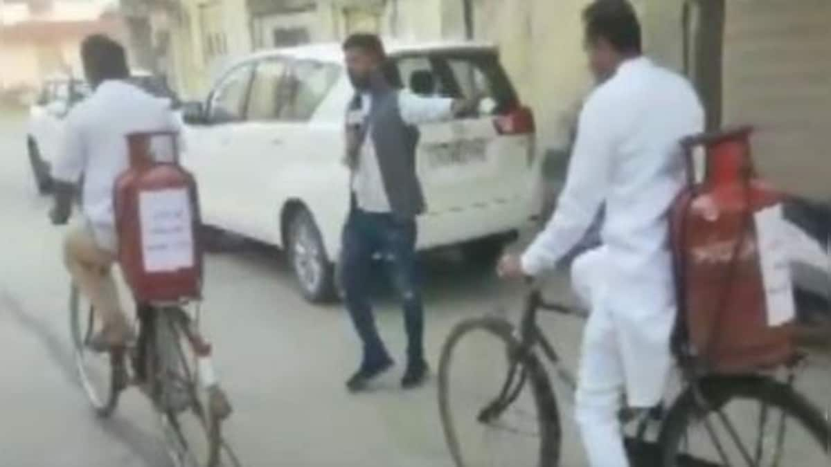 Watch: Congress MLA Paresh Dhanani carries gas cylinder on his bicycle to cast vote