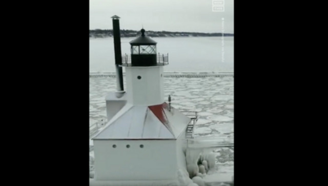 Watch: Lighthouse and surrounding pier in Lake Michigan shrouded in ice following blizzard Watch: Lighthouse and surrounding pier in Lake Michigan shrouded in ice following blizzard
