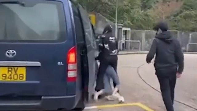 Watch: Woman kidnapped outside Hong Kong jail complex in broad daylight as guards look on Watch: Woman kidnapped outside Hong Kong jail complex in broad daylight as guards look on