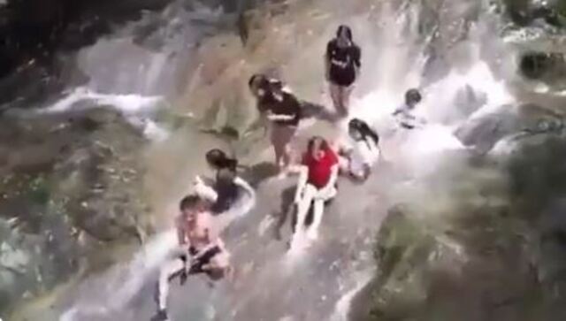 Viral video shows 'unaware' people being washed away by flash flood Viral video shows 'unaware' people being washed away by flash flood