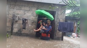 Philippines floods force tens of thousands to flee homes