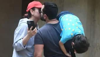 Watch: Kareena Kapoor, Saif Ali Khan share a kiss as Taimur hangs upside down from dad's shoulder