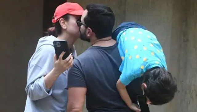 Watch: Kareena Kapoor, Saif Ali Khan share a kiss as Taimur hangs upside down from dad's shoulder Watch: Kareena Kapoor, Saif Ali Khan share a kiss as Taimur hangs upside down from dad's shoulder