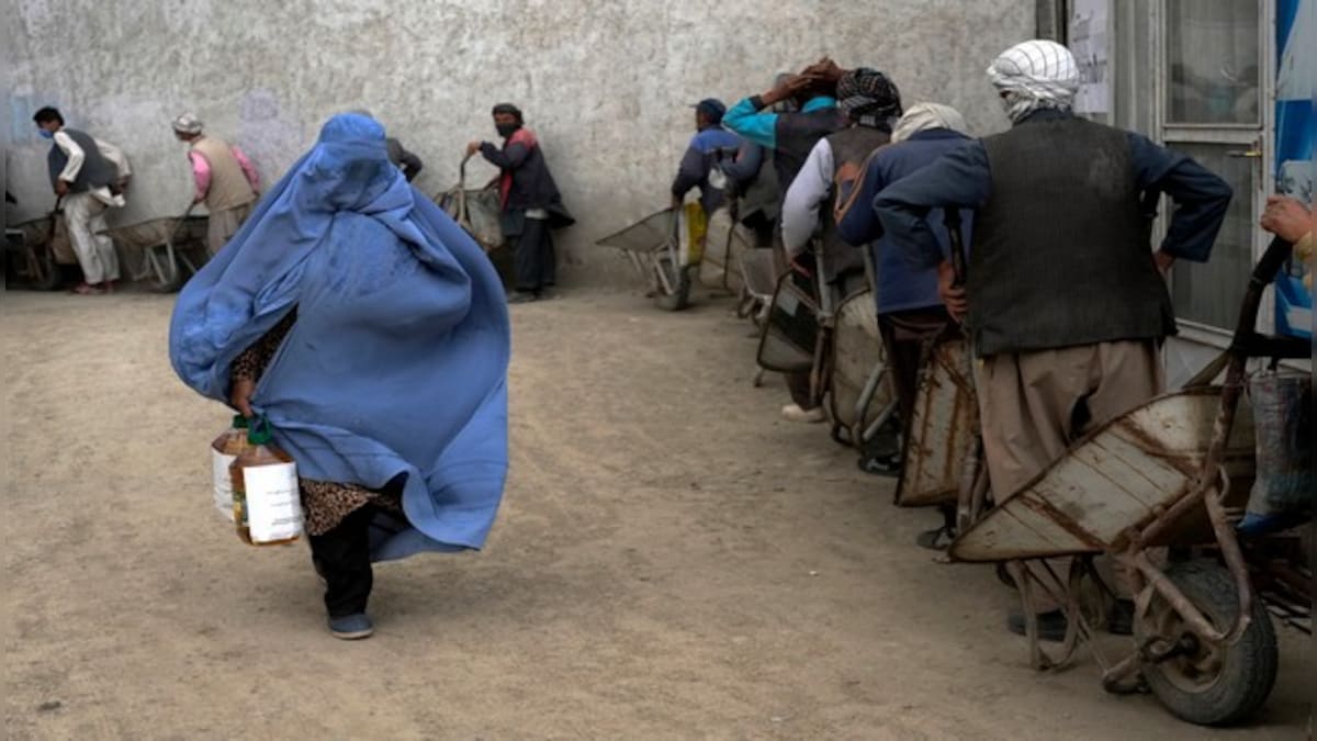 WATCH: Taliban surround a woman in a pit and stone her