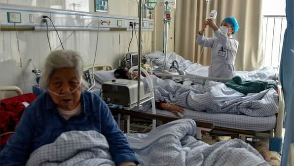WATCH: Sick doctors hooked to IV drips, treat patients as China Covid situation worsens
