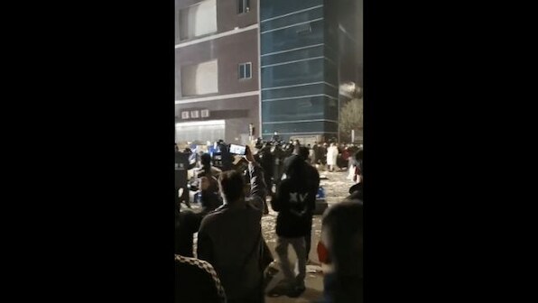 China: Scores of workers clash with police at COVID-19 test kit factory