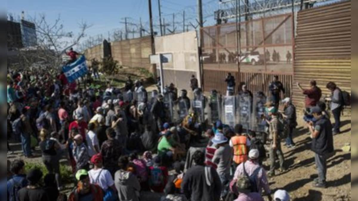 Hundreds of migrants attempt to storm the US-Mexico border