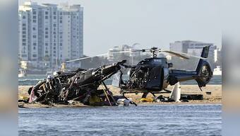 Helicopters collide over Australian beach, 4 passengers dead