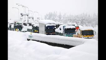 Heavy snow in Japan disrupts flights and trains, closes roads