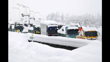 Heavy snow in Japan disrupts flights and trains, closes roads