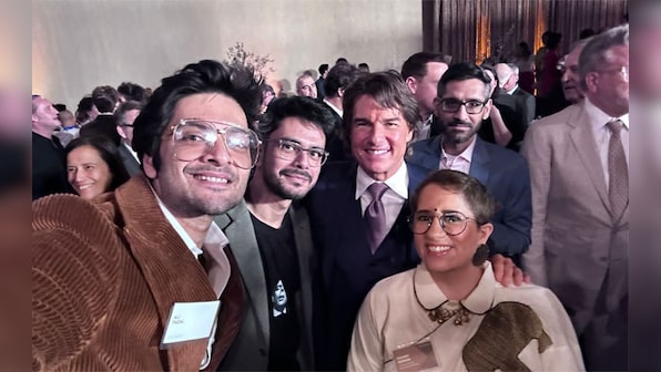 Ali Fazal strikes a pose with Tom Cruise along with All That Breathes director Shaunak Sen at Oscars luncheon