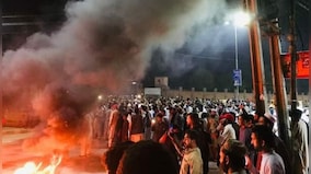 Imran Khan's party workers clash with police outside his Lahore residence to foil his arrest