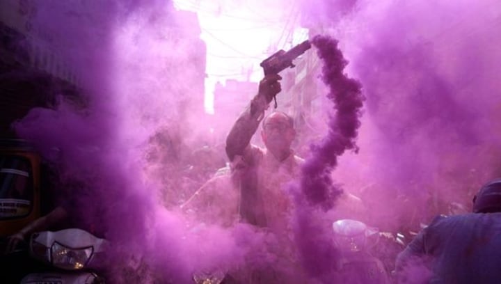 Painting the Town Red, Green and Purple: India celebrates Holi with vibrant colours, dance and music