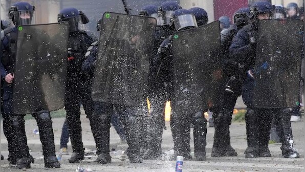 Paris police fire tear gas on protesters at oil giant's meeting