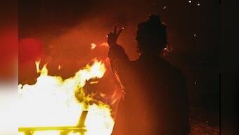 Iran protesters return to streets during fire festival, burn hijabs & Khamenei's posters