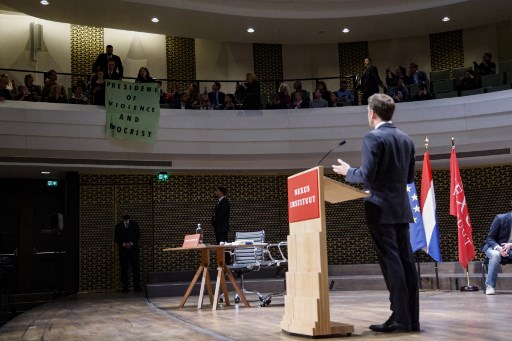 'Where is French democracy?': Protesters interrupt Macron's speech in Netherlands; WATCH 'Where is French democracy?': Protesters interrupt Macron's speech in Netherlands; WATCH